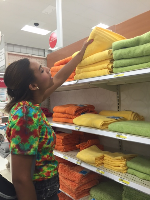 Teddi eyeing some colorful  Room Essentials ™   Fast Dry Solid bath towels .