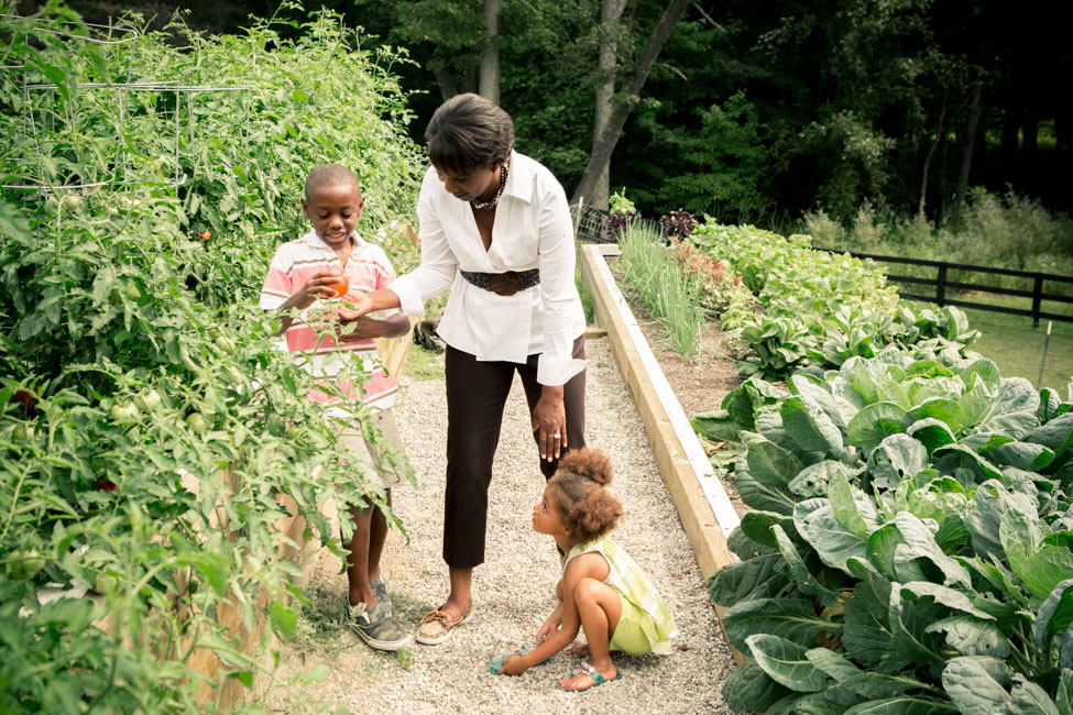 Candace Matthews with her children in the farm