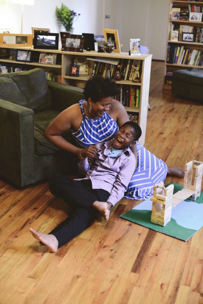 Takiema Bunche-Smith playing with her son