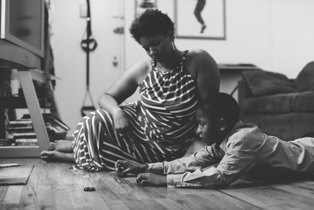 Black and white shot of Takiema Bunche-Smith with her son