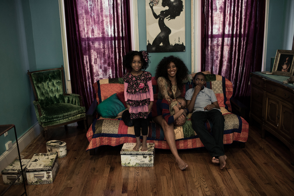 Hadiiya Barbel with both her children in the living room