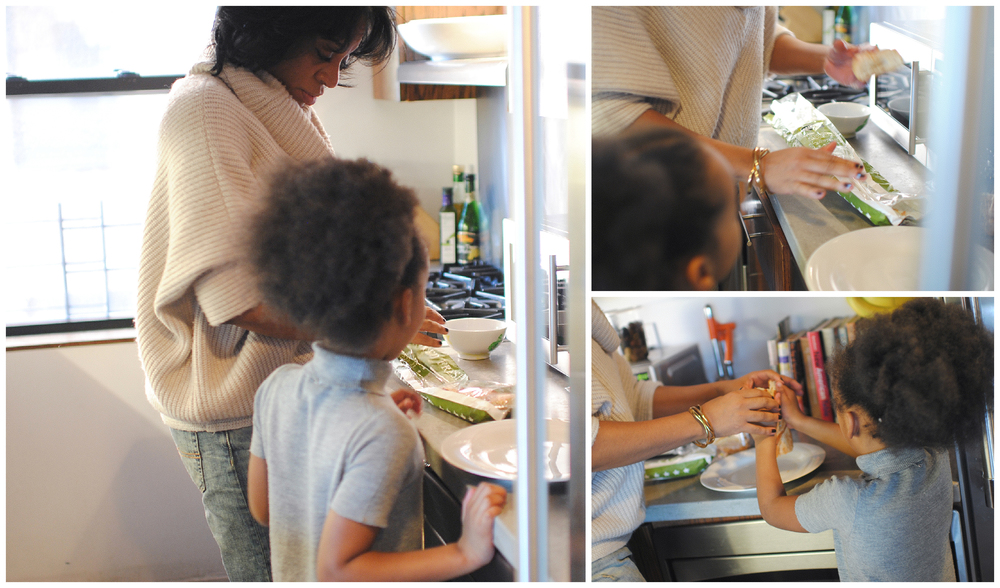 LaShann DeArcy Hall preparing a meal with her child