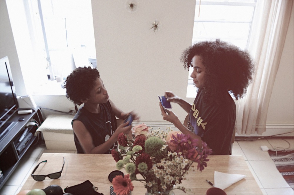 Nikisha Riley playing cards with her son, Jaden
