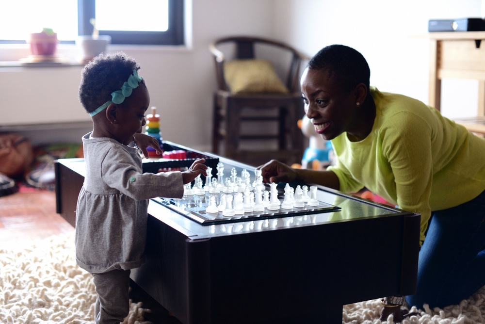 Nana Eyeson- Akiwowo playing with her daughter Omolara