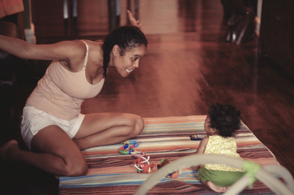 Staceyann Chin playing with her baby girl