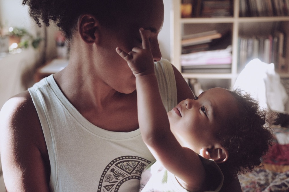Kamara Thomas holding her child