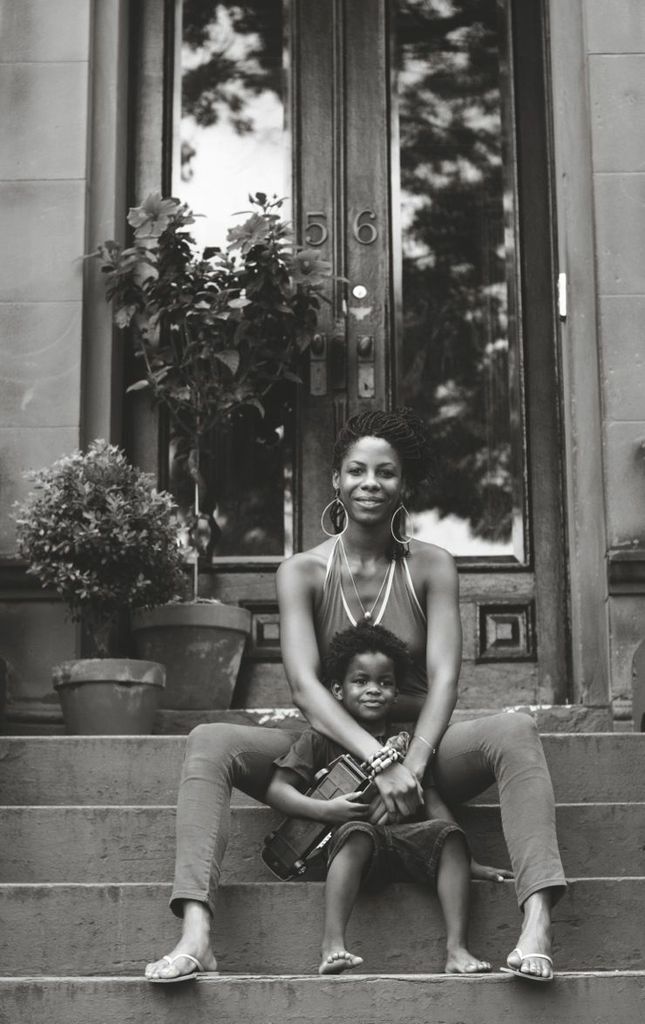 Nasozi Kakembo with her son on their porch