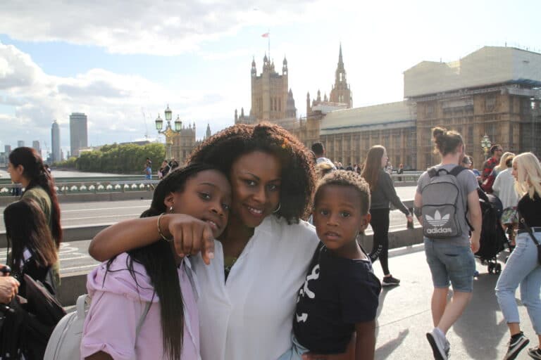 Bessie Akuba with her two children on London Bridge